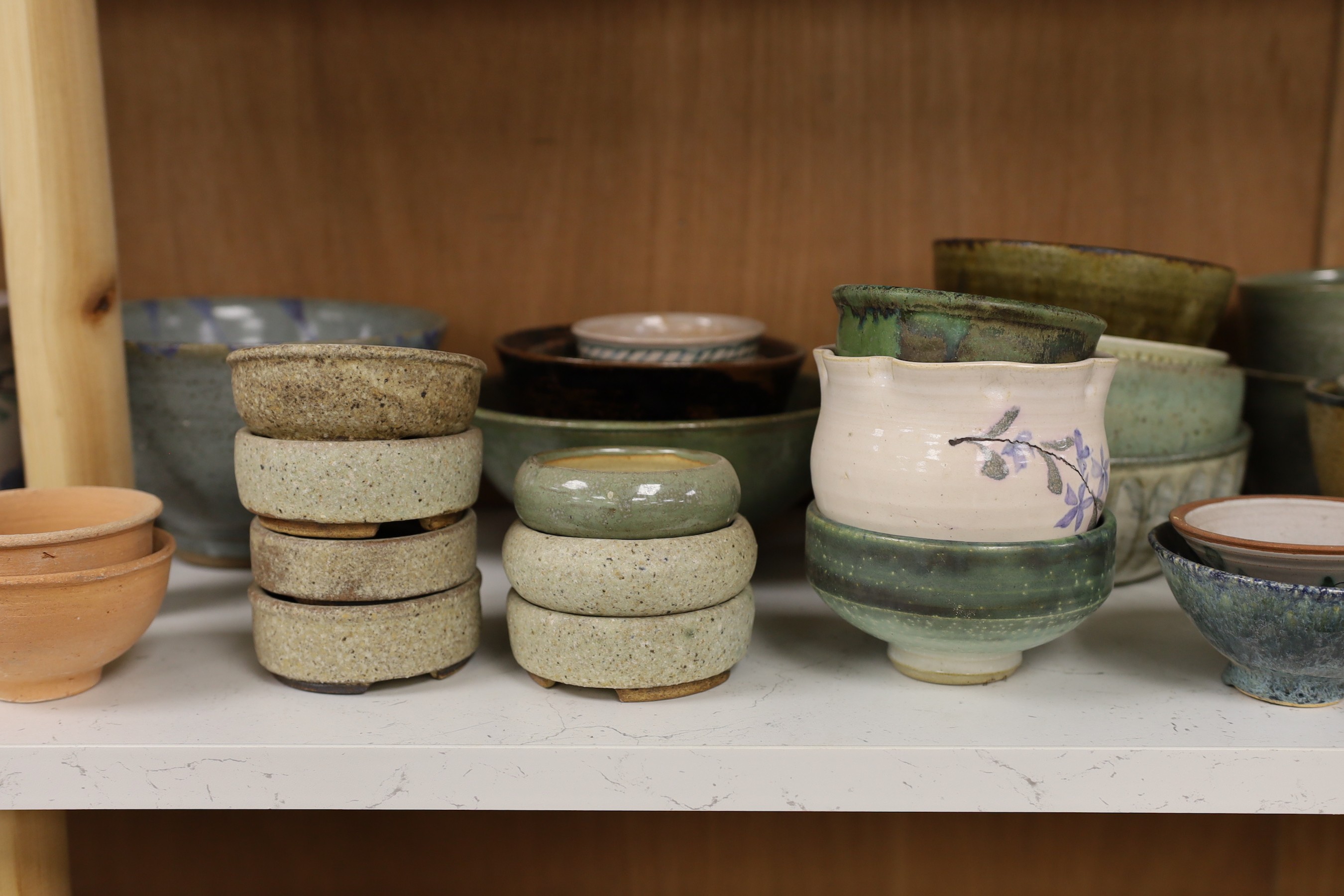 A large quantity of British studio pottery bowls and dishes, to include a vast amount by Susan Threadgold